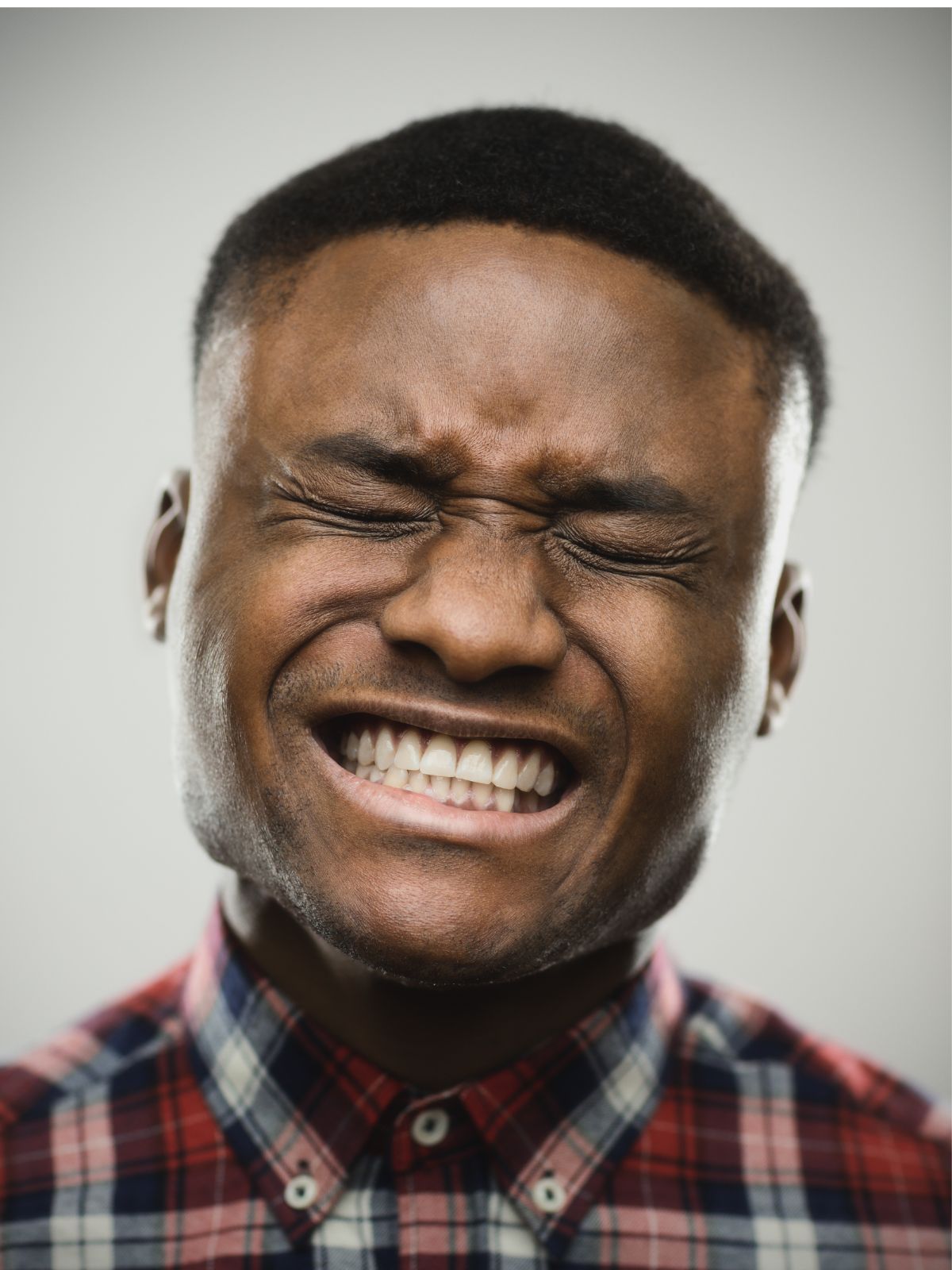 Man wincing in tooth pain